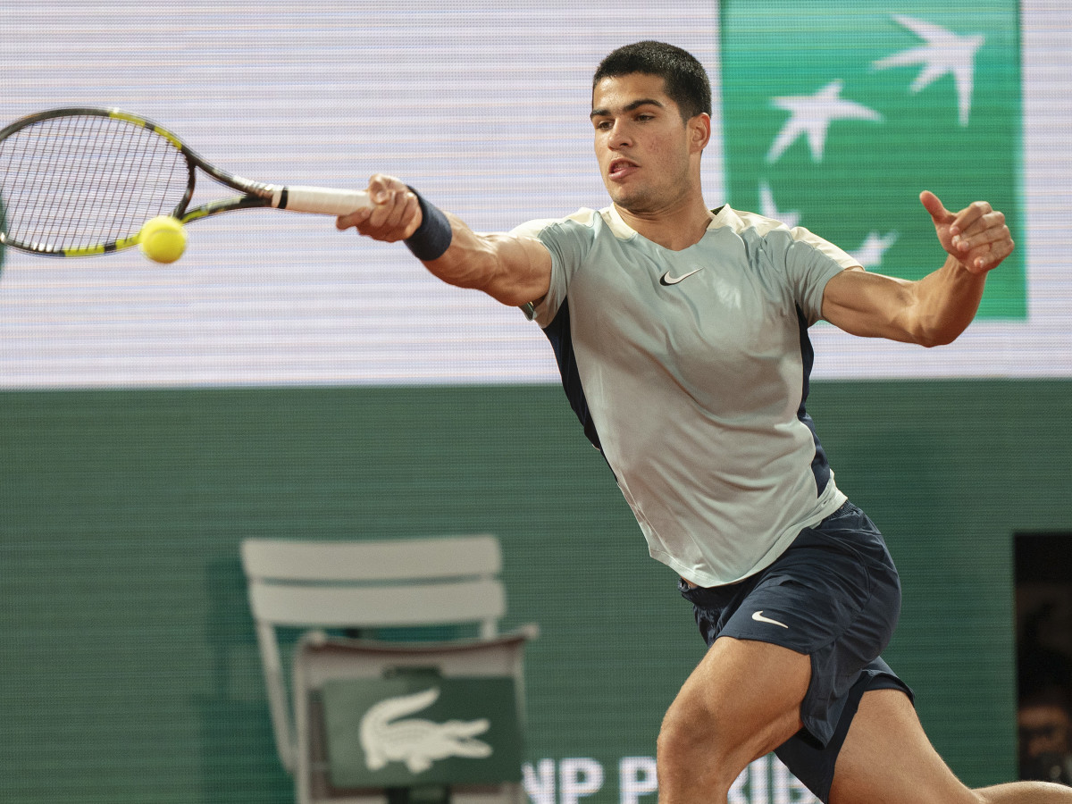 Carlos Alcaraz (ESP) returns a shot from Sebastian Korda (USA) during their match on day six of the French Open at Stade Roland-Garros.